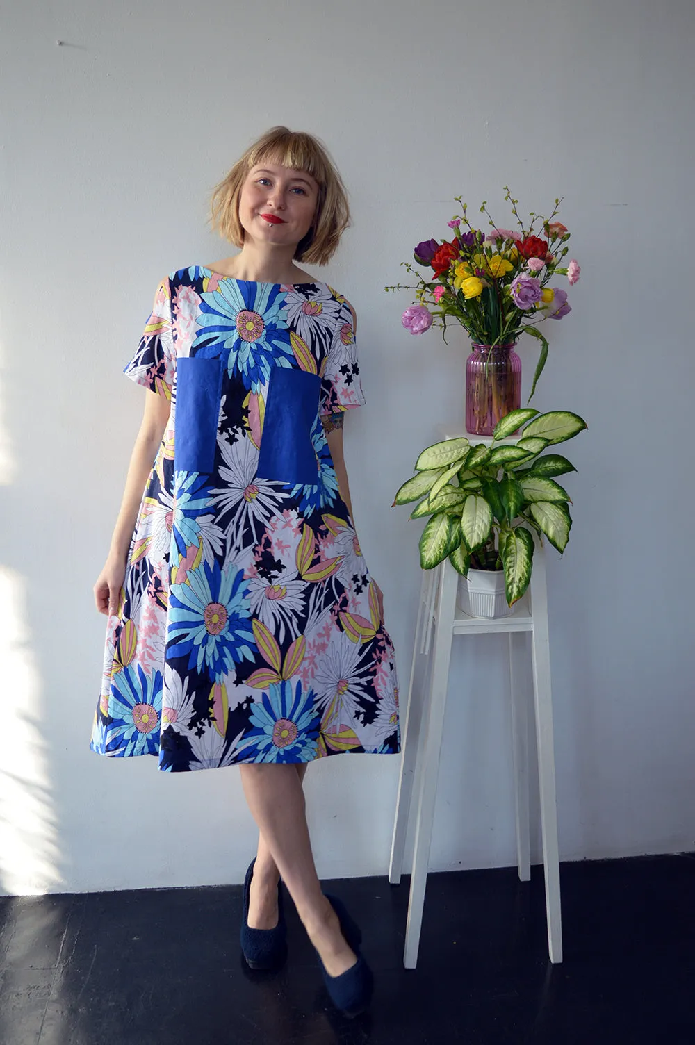 Colorful Linen Dress with Flower Pattern and Contrast Pockets and Naked Shoulder Detail.